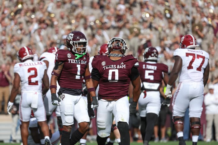 Texas A&M Aggies defensive lineman Walter Nolen (No. 0) celebrates a sack against Alabama Crismon Tide quarterback Jalen Milroe (No. 4) during the third quarter.